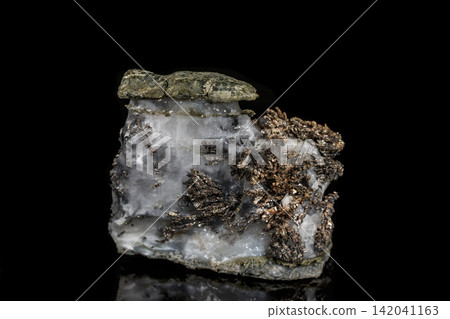 Macro stone mineral silver metal in the rock on a black background Macro stone mineral silver metal in the rock on a black background 142041163
