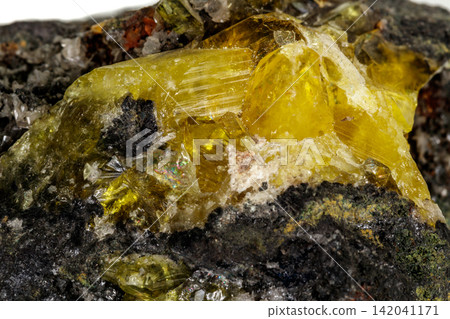 Macro of mineral stone Anglesite in Galena on white background Macro of mineral stone Anglesite in Galena on white background 142041171