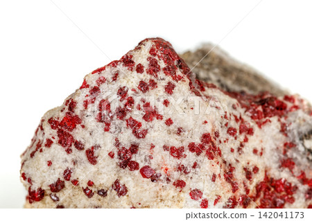 Macro stone mineral Cinnabar on a white background Macro stone mineral Cinnabar on a white background 142041173