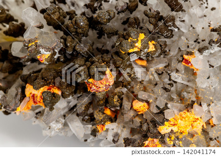 Macro of Realgar mineral stone on white background 142041174