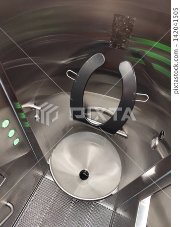 Modern public toilet cabin. Automatic metal WC restroom. Closet interior, lavatory basin and sink in room Modern public toilet cabin. Automatic metal WC restroom. Closet interior, lavatory basin and sink in room 142041505