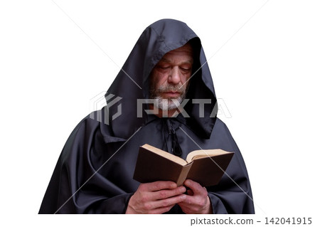 Solemn hooded monk reading an old book isolated on white Solemn hooded monk reading an old book isolated on white 142041915