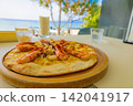 Seafood pizza at a seaside ocean-view restaurant/cafe - perfect for a hotel lunch or vacation (Amami Oshima, Kagoshima Prefecture) 142041917