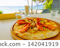 Seafood pizza at a seaside ocean-view restaurant/cafe - perfect for a hotel lunch or vacation (Amami Oshima, Kagoshima Prefecture) 142041919