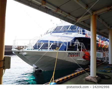 High-speed boat Rocket docked at Yakushima port 142042998