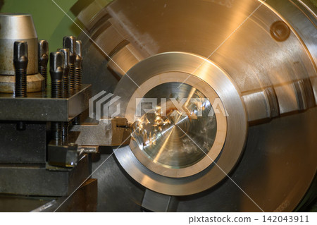 Face cutting process on metal shaft part during rough turning operation on lathe machine Face cutting process on metal shaft part during rough turning operation on lathe machine 142043911