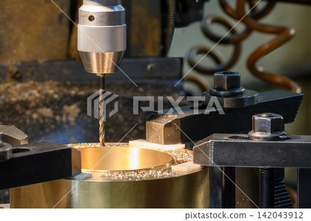 Hole making process on brass material part using drill tool on milling machine Hole making process on brass material part using drill tool on milling machine 142043912