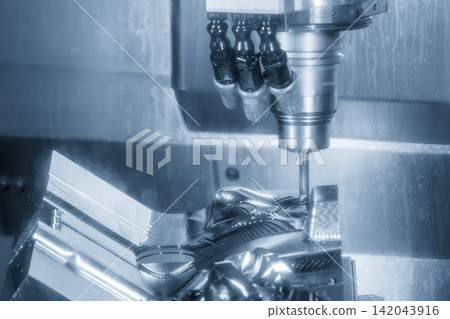 Mold and die rough cutting process on CNC milling machine with ball nose end mill tool in light blue tone Mold and die rough cutting process on CNC milling machine with ball nose end mill tool in light blue tone 142043916
