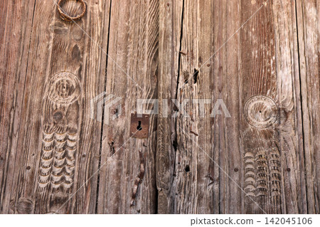 Close up brown wooden door texture Close up brown wooden door texture 142045106