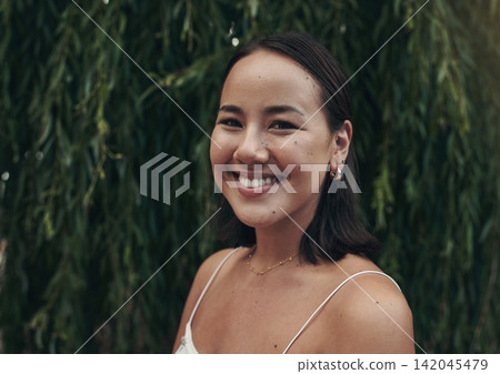 Portrait, girl and smile or outdoor, tree and closeup on face, happy and asian woman. Confident, nature and relaxed for adventure, cheerful and Thailand in summer, excited and park or garden 142045479