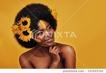 Black woman, studio and happy with natural sunflowers, nature skincare and rest with African model and afro. Selfcare, wellness for beauty with organic cosmetics, dermatology on yellow background Black woman, studio and happy with natural sunflowers, nature skincare and rest with African model and afro. Selfcare, wellness for beauty with organic cosmetics, dermatology on yellow background 142045542