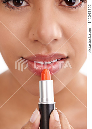 Woman, lipstick and cosmetics with makeup for beauty treatment on a white studio background. Closeup of female person, mouth or lips of model applying gloss, shine or glow in cosmetology or grooming Woman, lipstick and cosmetics with makeup for beauty treatment on a white studio background. Closeup of female person, mouth or lips of model applying gloss, shine or glow in cosmetology or grooming 142045592