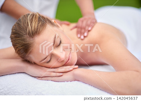 Massage, woman and spa for health, wellness and relaxation in muscles, back and neck for self care. Female person, physical therapy and detox for body with smile, calm and happiness on holiday Massage, woman and spa for health, wellness and relaxation in muscles, back and neck for self care. Female person, physical therapy and detox for body with smile, calm and happiness on holiday 142045637