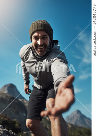 Hiking, hand support and man portrait in the Alps in mountains with eco travel and climbing with smile. Vacation, below and summit for exercise, fitness and training outdoor on holiday in nature 142045779