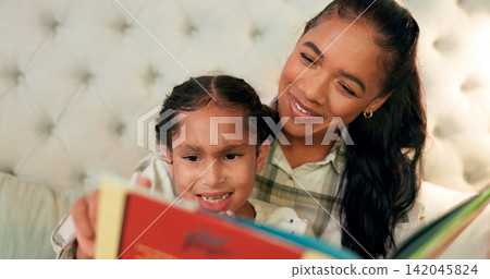Reading, mother and girl in bedroom with book, teaching and learning in family home and education. Knowledge, fantasy and storytelling, mama or daughter relax on bed together with love, care and calm Reading, mother and girl in bedroom with book, teaching and learning in family home and education. Knowledge, fantasy and storytelling, mama or daughter relax on bed together with love, care and calm 142045824