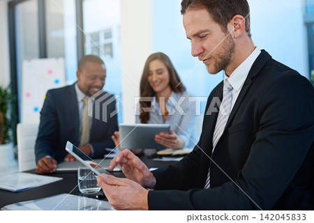 Office, lawyer or businessman on tablet at law firm for consulting, legal research or corporate case. Staff meeting, boardroom or attorney on technology for schedule update, news or feedback review Office, lawyer or businessman on tablet at law firm for consulting, legal research or corporate case. Staff meeting, boardroom or attorney on technology for schedule update, news or feedback review 142045833