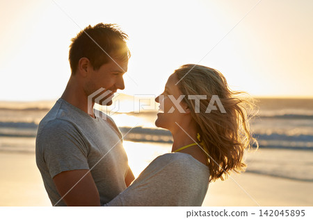 Love, sunset or happy couple hug at beach on holiday, vacation or anniversary romance in summer. Travel, smile and people on date at sea, nature or ocean for bonding, support and honeymoon in Hawaii Love, sunset or happy couple hug at beach on holiday, vacation or anniversary romance in summer. Travel, smile and people on date at sea, nature or ocean for bonding, support and honeymoon in Hawaii 142045895