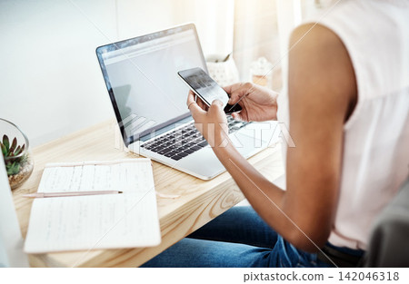 Office, phone and laptop in small business with fashion dropshipping, ecommerce logistics or planning. Online shopping, app and supply chain in sales, delivery or communication with client and seller Office, phone and laptop in small business with fashion dropshipping, ecommerce logistics or planning. Online shopping, app and supply chain in sales, delivery or communication with client and seller 142046318