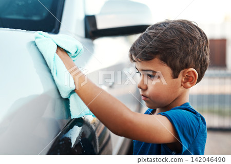Child, car and cleaning with cloth outdoor for youth responsibility or discipline, chores or shining. Boy, vehicle and polish activity for household to do list for helping task, service or learning Child, car and cleaning with cloth outdoor for youth responsibility or discipline, chores or shining. Boy, vehicle and polish activity for household to do list for helping task, service or learning 142046490