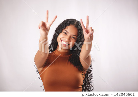 Peace sign, happy and portrait of woman in studio for confidence, pride and fashion style. Emoji, smile and isolated person with hand gesture for positive attitude, joy and love on white background Peace sign, happy and portrait of woman in studio for confidence, pride and fashion style. Emoji, smile and isolated person with hand gesture for positive attitude, joy and love on white background 142046601