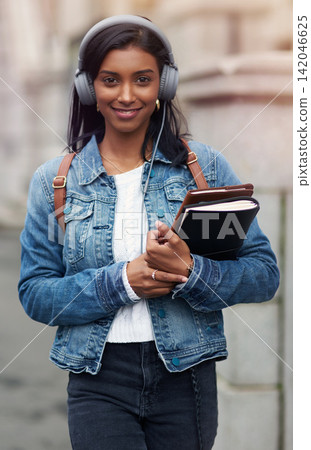 City, books and portrait of student with headphones for education, travel and music on commute to campus. University, Indian girl and journal with technology for learning, journey and audio streaming City, books and portrait of student with headphones for education, travel and music on commute to campus. University, Indian girl and journal with technology for learning, journey and audio streaming 142046625