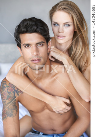 Couple, hug and portrait in bedroom on morning, love and romance bonding in home for relationship. People, embrace and security in marriage connection, care and rest in hotel on vacation or holiday Couple, hug and portrait in bedroom on morning, love and romance bonding in home for relationship. People, embrace and security in marriage connection, care and rest in hotel on vacation or holiday 142046685