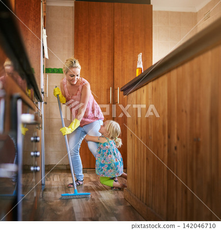 Mother, girl and cling on leg to sweep floor for cleaning, care and broom for dirt or dust in home. Mommy, daughter and loving child for hygiene or housework, maid and tidy apartment for service Mother, girl and cling on leg to sweep floor for cleaning, care and broom for dirt or dust in home. Mommy, daughter and loving child for hygiene or housework, maid and tidy apartment for service 142046710