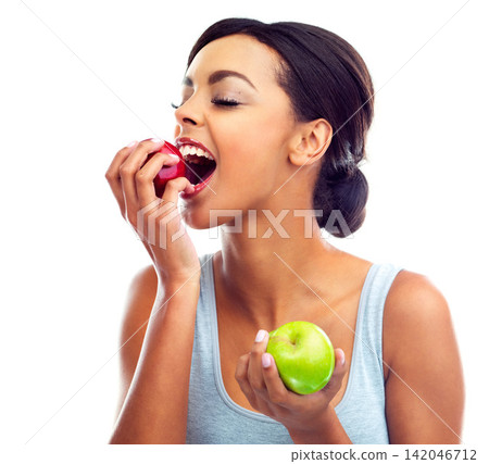 Face, bite and woman with apple, nutrition and sustainable eating to lose weight in studio. Fruit, happy and girl with fresh food for detox diet, vitamins and gut health on white background. Face, bite and woman with apple, nutrition and sustainable eating to lose weight in studio. Fruit, happy and girl with fresh food for detox diet, vitamins and gut health on white background. 142046712