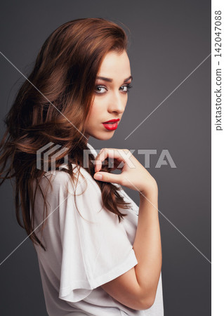Red lipstick, cosmetic and portrait of woman in studio for beauty, glow and facial routine Confident, makeup and female person with trendy cosmetology face treatment isolated by gray background. Red lipstick, cosmetic and portrait of woman in studio for beauty, glow and facial routine Confident, makeup and female person with trendy cosmetology face treatment isolated by gray background. 142047088