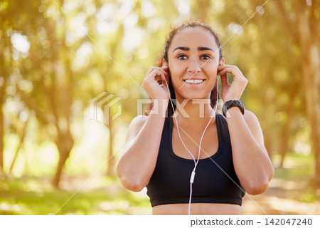 Black woman, park and earphones with music for exercise, sport training and podcast for running. Thinking, workout and African girl outdoor with listening to radio and ideas for playlist in Colombia Black woman, park and earphones with music for exercise, sport training and podcast for running. Thinking, workout and African girl outdoor with listening to radio and ideas for playlist in Colombia 142047240