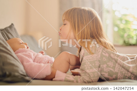 Family, love and sister kissing baby girl on bed in home together for care, relationship or support. Bedroom, children and youth with sibling kids bonding in apartment for child development or growth Family, love and sister kissing baby girl on bed in home together for care, relationship or support. Bedroom, children and youth with sibling kids bonding in apartment for child development or growth 142047254