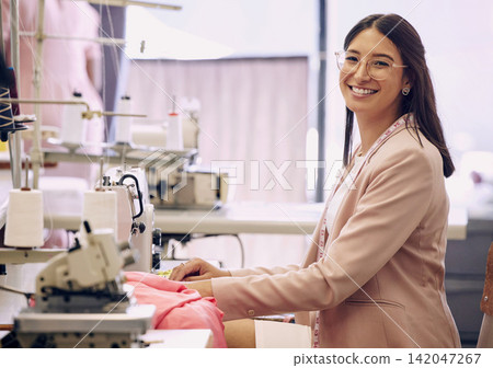 Happy, woman and designer or sewing with machine in portrait for creative ideas or design for wedding dresses. Confident, seamstress and fashion industry with fabric or product for bridal boutique Happy, woman and designer or sewing with machine in portrait for creative ideas or design for wedding dresses. Confident, seamstress and fashion industry with fabric or product for bridal boutique 142047267