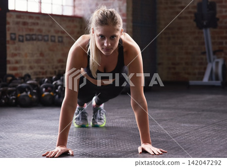 Fitness, plank and woman in portrait in gym for workout, training and strength for core muscle. Female athlete, physical activity and exercise with balance, endurance and commitment in sports Fitness, plank and woman in portrait in gym for workout, training and strength for core muscle. Female athlete, physical activity and exercise with balance, endurance and commitment in sports 142047292