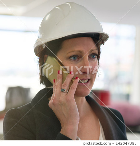Phone call, helmet and woman in site for construction, affirmative action and inspector visit in building. Contractor, female employee and inspection of property, development and report for company Phone call, helmet and woman in site for construction, affirmative action and inspector visit in building. Contractor, female employee and inspection of property, development and report for company 142047383