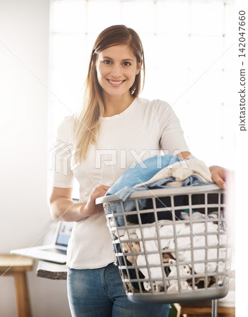 House, portrait and woman with a laundry basket for cleaning with chores, housekeeping and hygiene. Face, female person or cleaner with dirty clothes, apartment and washing fabric with smile in home House, portrait and woman with a laundry basket for cleaning with chores, housekeeping and hygiene. Face, female person or cleaner with dirty clothes, apartment and washing fabric with smile in home 142047660