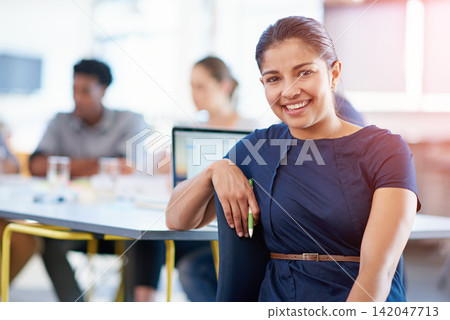 Pride, meeting and portrait of business woman with laptop in office for finance research with team. Happy, confident and female financial advisor with computer for corporate budget plan discussion. Pride, meeting and portrait of business woman with laptop in office for finance research with team. Happy, confident and female financial advisor with computer for corporate budget plan discussion. 142047713