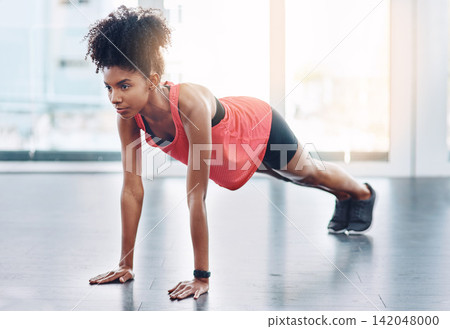 Black woman, push up and exercise in gym for fitness, strong arms and core or abs in workout. Female person, training and body challenge for bodybuilder, resilience and cardio routine for wellness Black woman, push up and exercise in gym for fitness, strong arms and core or abs in workout. Female person, training and body challenge for bodybuilder, resilience and cardio routine for wellness 142048000