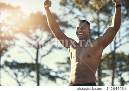 Victory, sports and forest for African man, athlete and nature for workout, training and exercise. Active, energy and person in environment, muscle and wellness for fitness and healthy body outdoor Victory, sports and forest for African man, athlete and nature for workout, training and exercise. Active, energy and person in environment, muscle and wellness for fitness and healthy body outdoor 142048084