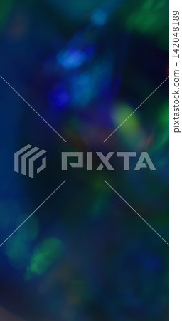 Bokeh art. Visual neon light. Green blue colorful radiant texture optical gleam ray flash on abstract illuminated vivid background. Bokeh art. Visual neon light. Green blue colorful radiant texture optical gleam ray flash on abstract illuminated vivid background. 142048189