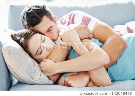 Peace, couple or hug while sleeping on sofa with love, safety and protection, rest or calm bonding at home. Sleep, security or people in living room for quiet snooze, nap or relax on weekend in house Peace, couple or hug while sleeping on sofa with love, safety and protection, rest or calm bonding at home. Sleep, security or people in living room for quiet snooze, nap or relax on weekend in house 142048478