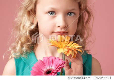 Portrait, child or girl with flowers by pink background for birthday picture, celebration or memory with plants. Studio, kid and barberton daisy with different color, floral and decoration by mockup Portrait, child or girl with flowers by pink background for birthday picture, celebration or memory with plants. Studio, kid and barberton daisy with different color, floral and decoration by mockup 142048491