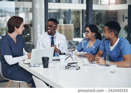 Discussion, laptop and team of doctors in office for medical treatment, diagnosis or surgery planning in clinic. Meeting, computer and surgeon with group of healthcare interns learning in hospital. Discussion, laptop and team of doctors in office for medical treatment, diagnosis or surgery planning in clinic. Meeting, computer and surgeon with group of healthcare interns learning in hospital. 142048583