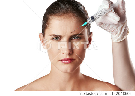 Woman, portrait and hand with needle in forehead or wrinkles plastic surgery, cosmetics or face lift. Female person, injection and frown for anti aging results in studio, white background or mockup 142048603