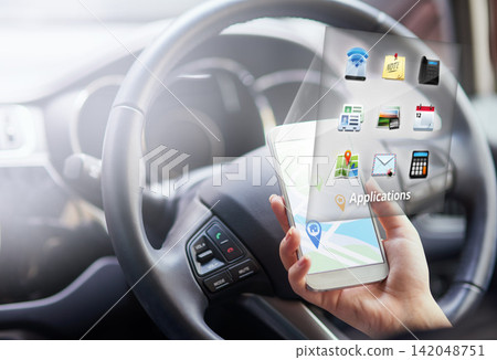 Woman, hands and smartphone with hologram in car with digital maps for smart driving and assist with navigation. Person, vehicle and mobile applications or features for location services and online. Woman, hands and smartphone with hologram in car with digital maps for smart driving and assist with navigation. Person, vehicle and mobile applications or features for location services and online. 142048751
