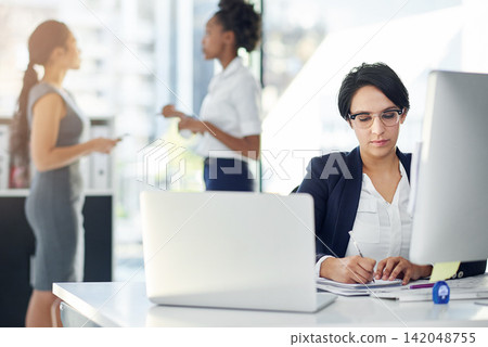 Businesswoman, working and computer in office, writing notes and laptop. Workplace, corporate and signing document at her desk or planning, professional and strategy for comparing, ideas and tech Businesswoman, working and computer in office, writing notes and laptop. Workplace, corporate and signing document at her desk or planning, professional and strategy for comparing, ideas and tech 142048755