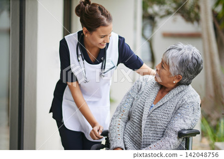 Senior woman and wheelchair at nursing home with carer for assistance in closeup, help at clinic. Disabled retiree and medical or outdoors for talk or plan for healthcare, conversation with nurse 142048756