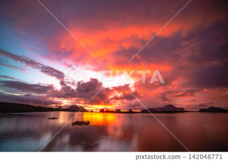 Aerial view of Peaceful Ocean View Under a Spectacular Evening Sky Aerial view of Peaceful Ocean View Under a Spectacular Evening Sky 142048771