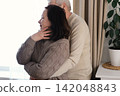 Emotional Dance. Senior Couple Dancing Together Embrace at Home. Elderly man and woman dancing bonding, smiling, moving to the rhythm in romantic vibe enjoying their anniversary. Active relationship 142048843
