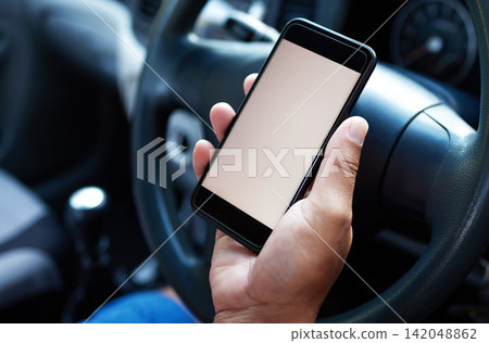 Travel, car and man with mockup in phone for navigation search, road trip and transportation. Driver, gps and person in motor vehicle with space on tech for location, direction and connectivity Travel, car and man with mockup in phone for navigation search, road trip and transportation. Driver, gps and person in motor vehicle with space on tech for location, direction and connectivity 142048862