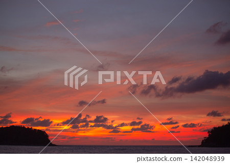 aerial view colorful cloud above the island at sunset. aerial view colorful cloud above the island at sunset. 142048939